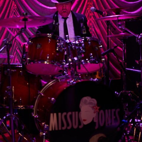 The drum kit with the Missus Jones name on the kick drum